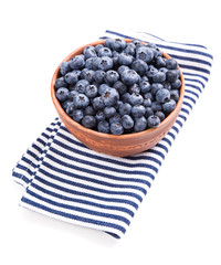 Bowl of ripe blueberries isolated on white