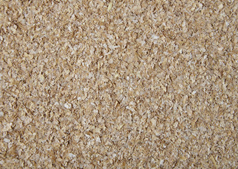 A full page of ground wheat bran background texture 