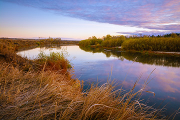 Colorfull autumn landscape with river at sunrise
