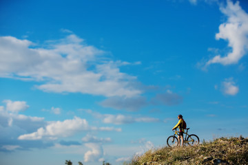 Fototapeta na wymiar Young man cycling on a rural road