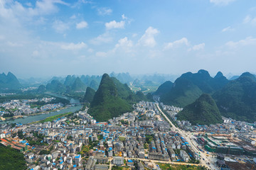 Fototapeta premium Air view on Yangshuo city with karst mountains around. Yangshuo, China