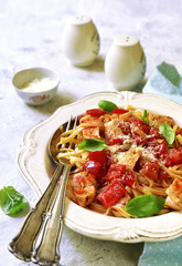 Tagliatelle with chicken,bell pepper and tomatoes.Top view.