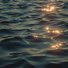 Naklejka premium Sparkling sunlight on oceanic waves 