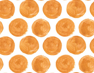 Seamless pattern with large golden circles painted in watercolor on white isolated background