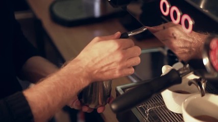 Coffee maker preparing hot milk foam 