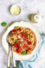 Tagliatelle with chicken,bell pepper and tomatoes.Top view.