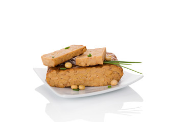 Tempeh isolated on white.