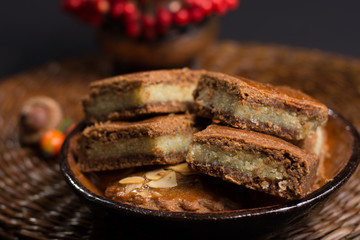 Typical Dutch filled spicy  cookies with almonds on autumn color
