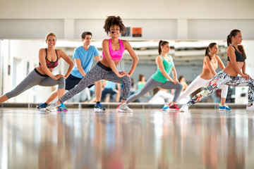 Black curly trainer with group training aerobic