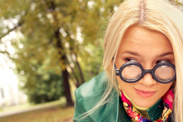 Close-up of beautiful girl s face in funny glasses