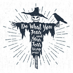 Hand drawn Halloween label with textured scarecrow vector illustration and "Do what you fear and your fear disappears" inspirational lettering.