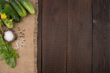 Fresh cucumbers on the old wooden table.