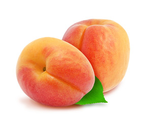 Two fresh apricots with green leaves isolated on white background. Design element for product label, catalog print, web use.