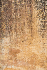 Cracked light beige coloured background texture