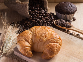 Croissants  with coffee beans background.