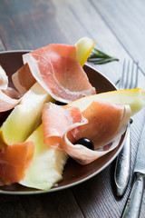 melon and prosciutto with olives