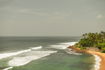 Fototapeta na wymiar sea or ocean waves and blue sky on Sri Lanka beach
