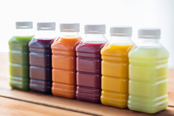 bottles with different fruit or vegetable juices