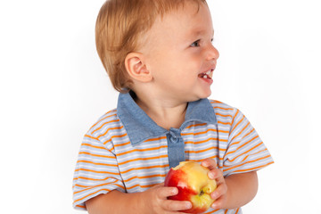 Adorable baby eating an apple