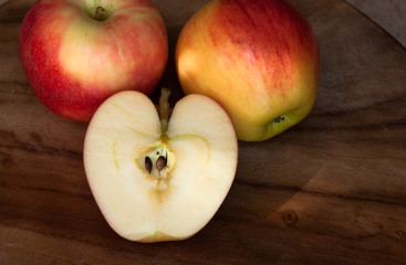 Naklejka na ściany i meble Apples on wooden table 