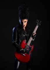 Fototapeta na wymiar Young woman rock musician