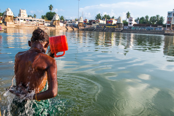 Kumbakonam, Tamil Nadu, India.  Woman bathes in the sacred lake Mahamaham.in the town of Kumbakonam.
