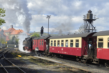 WERNINGERODE, HARZ, GERMANY. Steam train of the Harzer narrow gauge railway leaving the station of Werningerode. The trains to the Brocken mountain are popular with tourists 