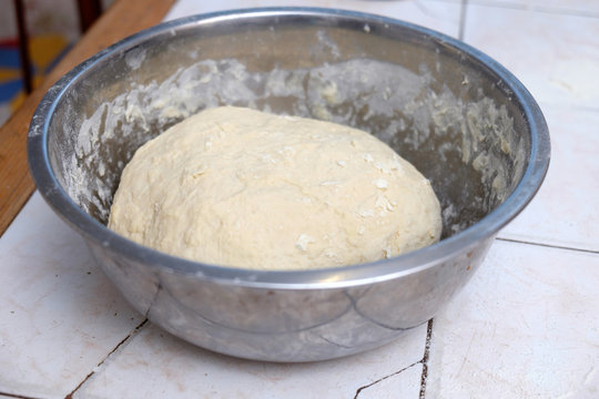 Dough in a metal bowl
