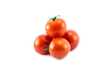 Fresh tomatoes and a slice isolated on a white background.