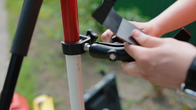 Worker prepare geodetic device for surveying