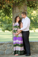 Fototapeta premium Young pregnant wife with her husband