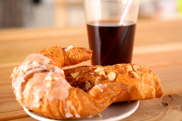 Croissant in the plate on the table