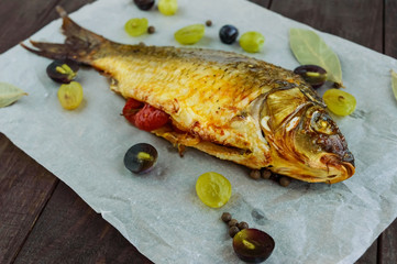 Baked fish carp, stuffed bell peppers and grapes.