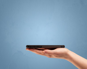 Holding telephone device from profile