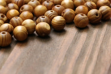 wooden beads close-up on a background of wooden boards.