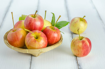 Red and yellow apple   on wooden background