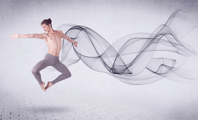 Modern ballet dancer performing with abstract swirl