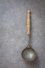 dark background, vintage utensils with wooden handles