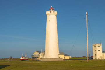 Lighthouse at seashore of Iceland, summer time
