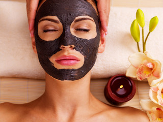 Cosmetologist doing massage on the woman's face  in sap salon