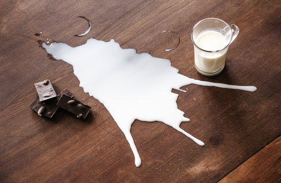 Chocolate And Spilled Milk On The Table.