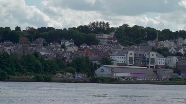 The houses on the riverside in Londonderry. Derry also known as Londonderry is a city on the River Foyle in Northern Ireland.