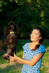 girl with black poodle