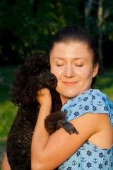 girl with black poodle