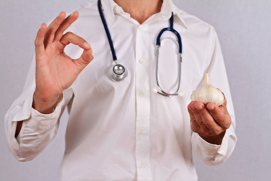 Doctor recommended garlic , natural antibiotic , health care alternative medicine concept