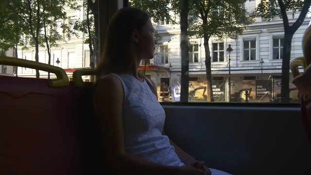 Woman tourist sightseeing through the tram window