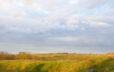 Fototapeta na wymiar Cloud sky at evening and summer field.