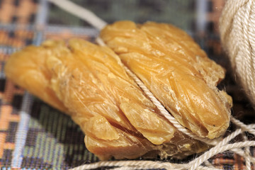 Waxing thread with shoemaker's wax, for sewing the leather