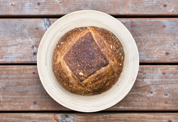 Homemade artisan bread on a round plate