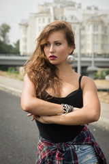 Young girl dancing regeton on a city street